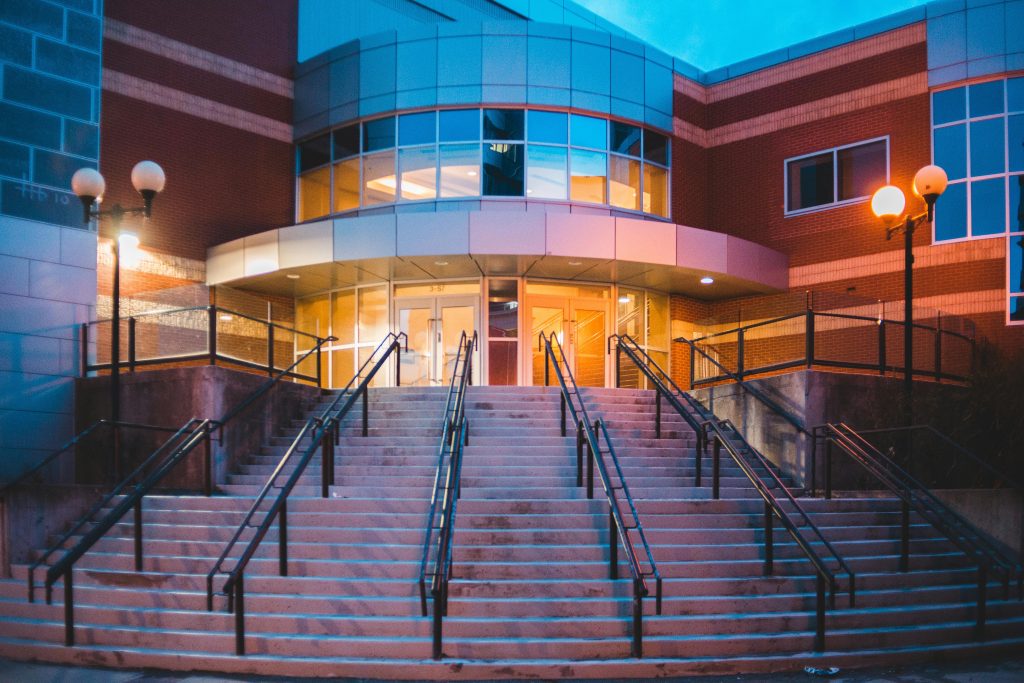 Image showing a modern office building with security cameras and access control systems in place. Protect your employees and assets with our comprehensive Office Security Systems Services