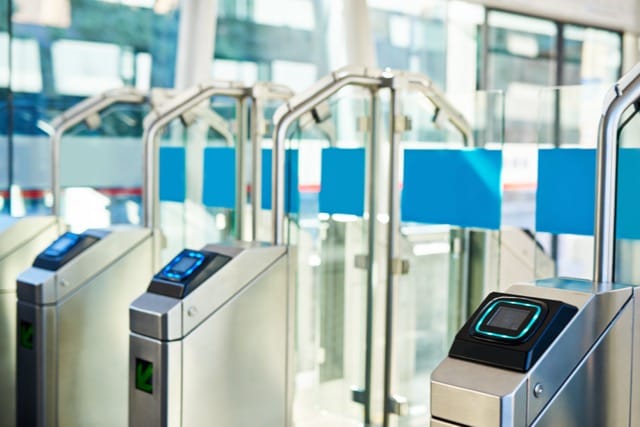 Turnstile access control system with fingerprint scanner, showcasing why access control systems are essential for secure entry management.