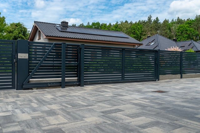A black electric gate picture for home security and safe from criime.