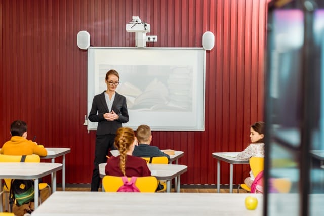 A CCTV camera installed in a school hallway, enhancing security and monitoring to ensure student safety and prevent incidents.