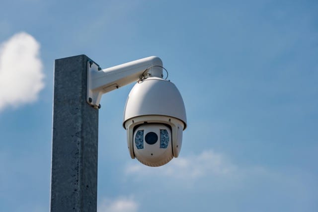 CCTV Installer Hiring Guide: a cctv setting up by installer on street.